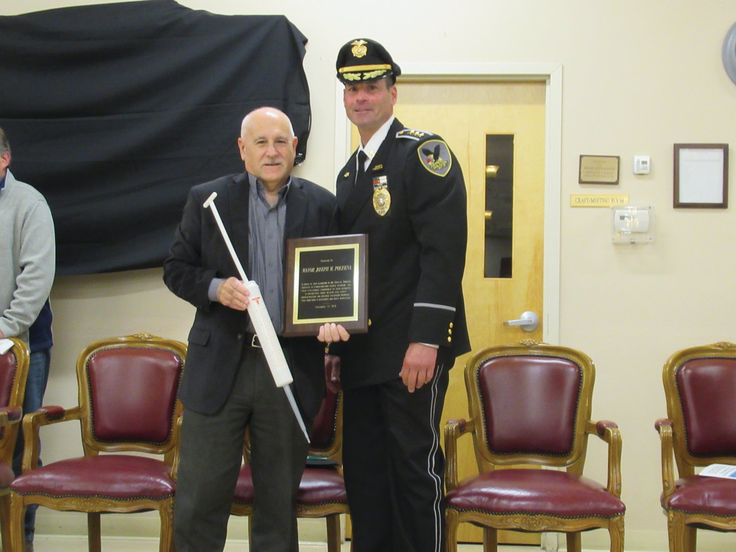 SPECIAL SURPRISE: JPD Chief Joseph P. Razza presented a giant-size syringe to Mayor Joseph Polisena for saying “YES” to having the town, police and fire department host recent and highly-successful COVID-19 Vaccination Clinics.